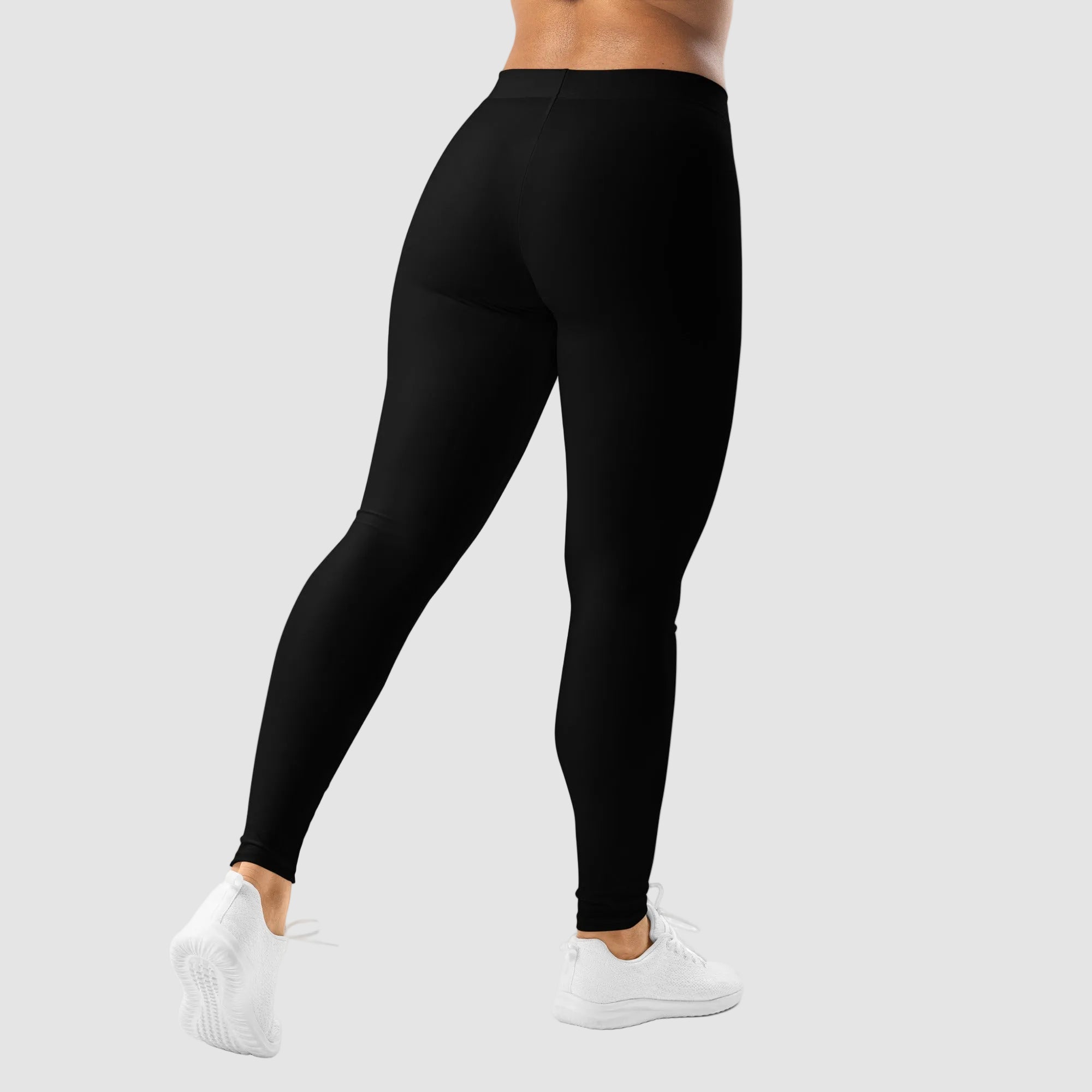 Person wearing black leggings on a white background