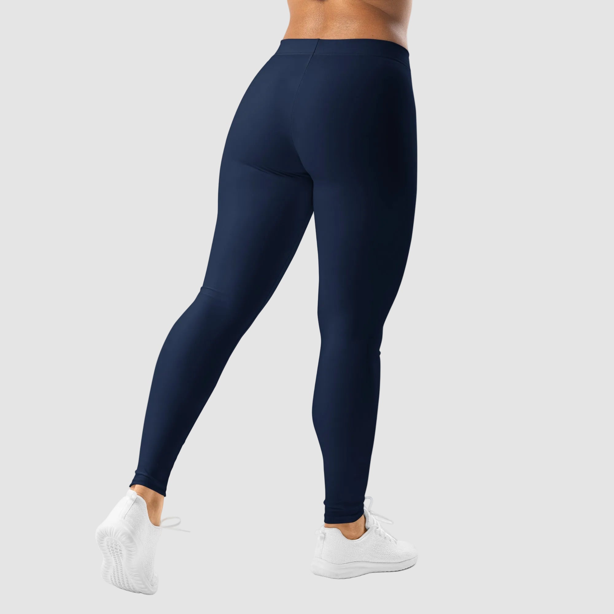 Navy blue leggings worn by a person on a white background