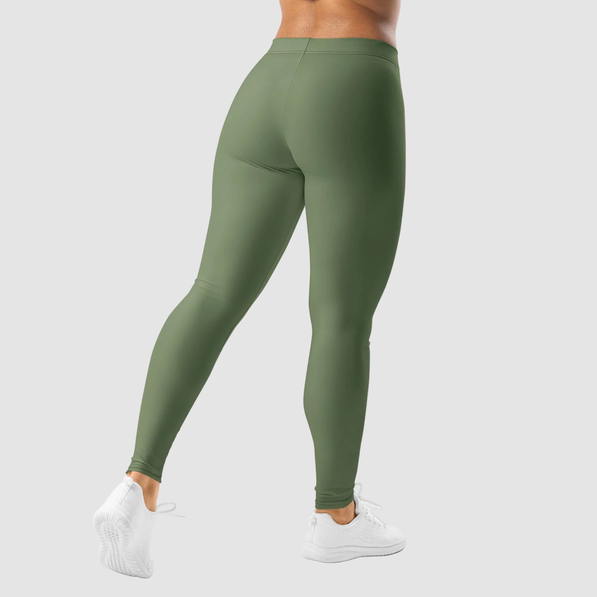 Green leggings worn by a person on a white background