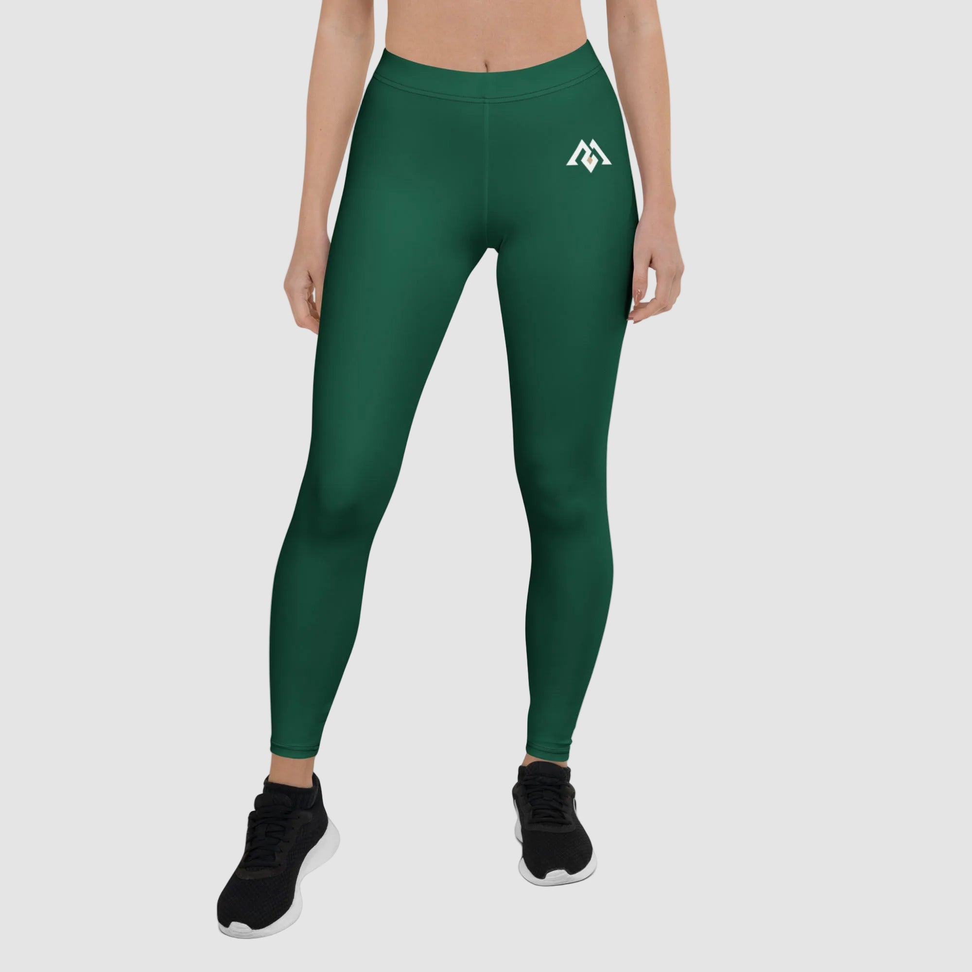 Green leggings with a logo on a white background