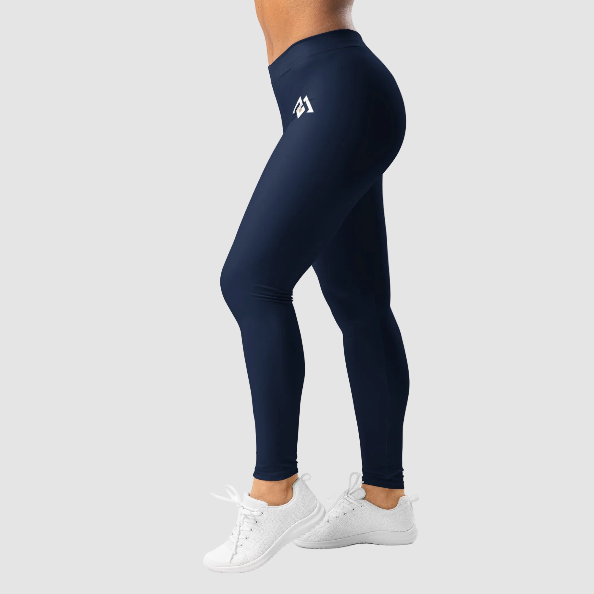Navy leggings with a logo worn by a person on a white background