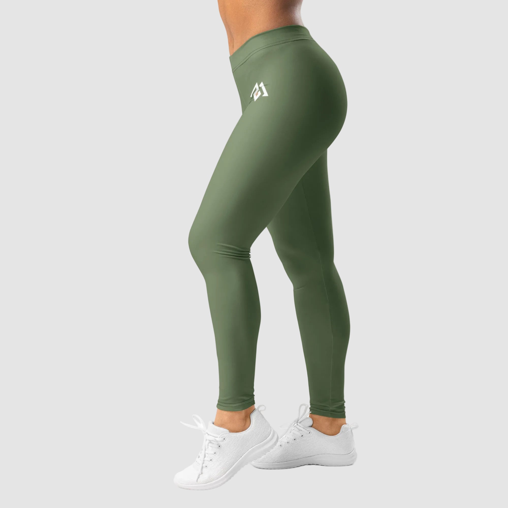 Green leggings with a logo worn by a person on a white background