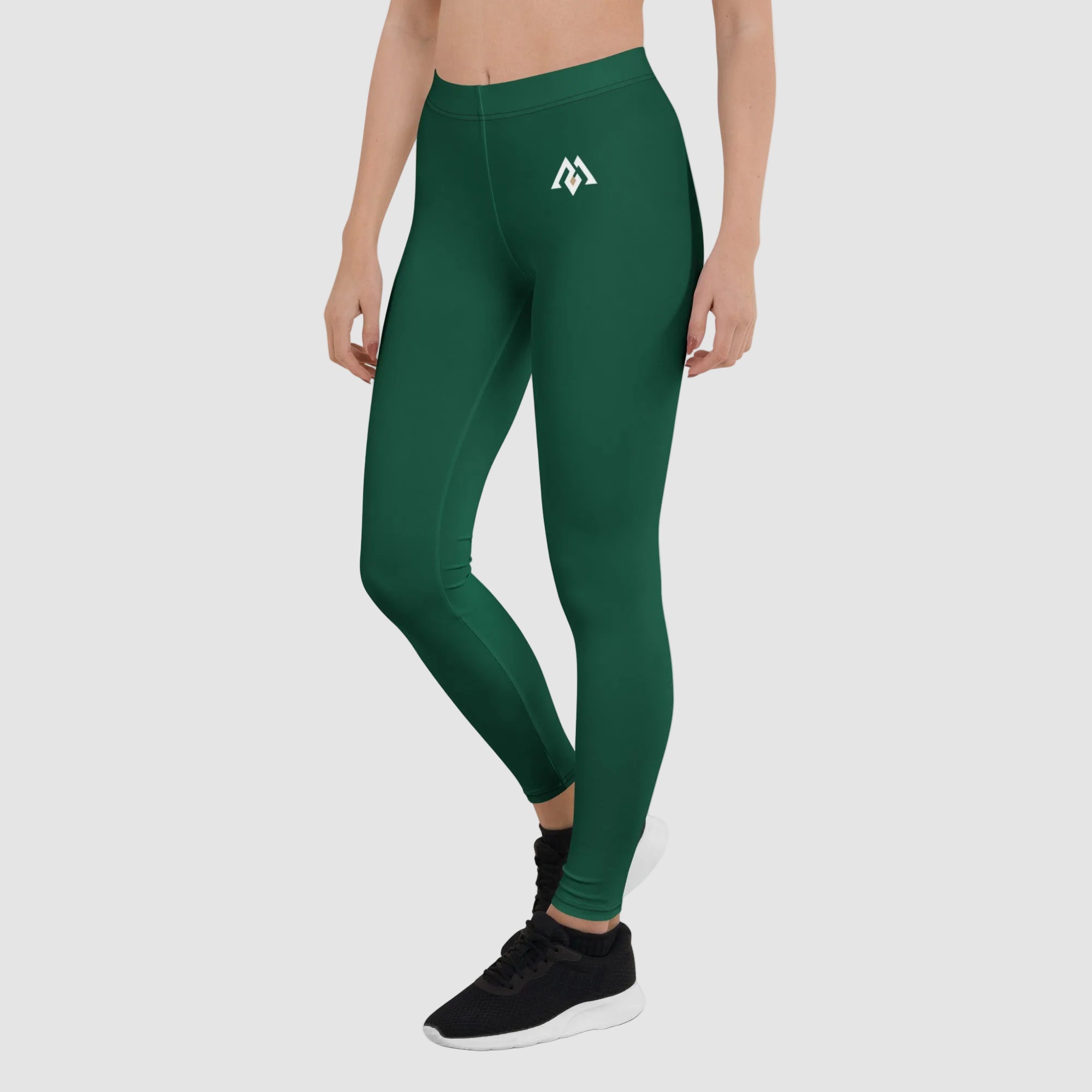 Green leggings with a logo on a white background