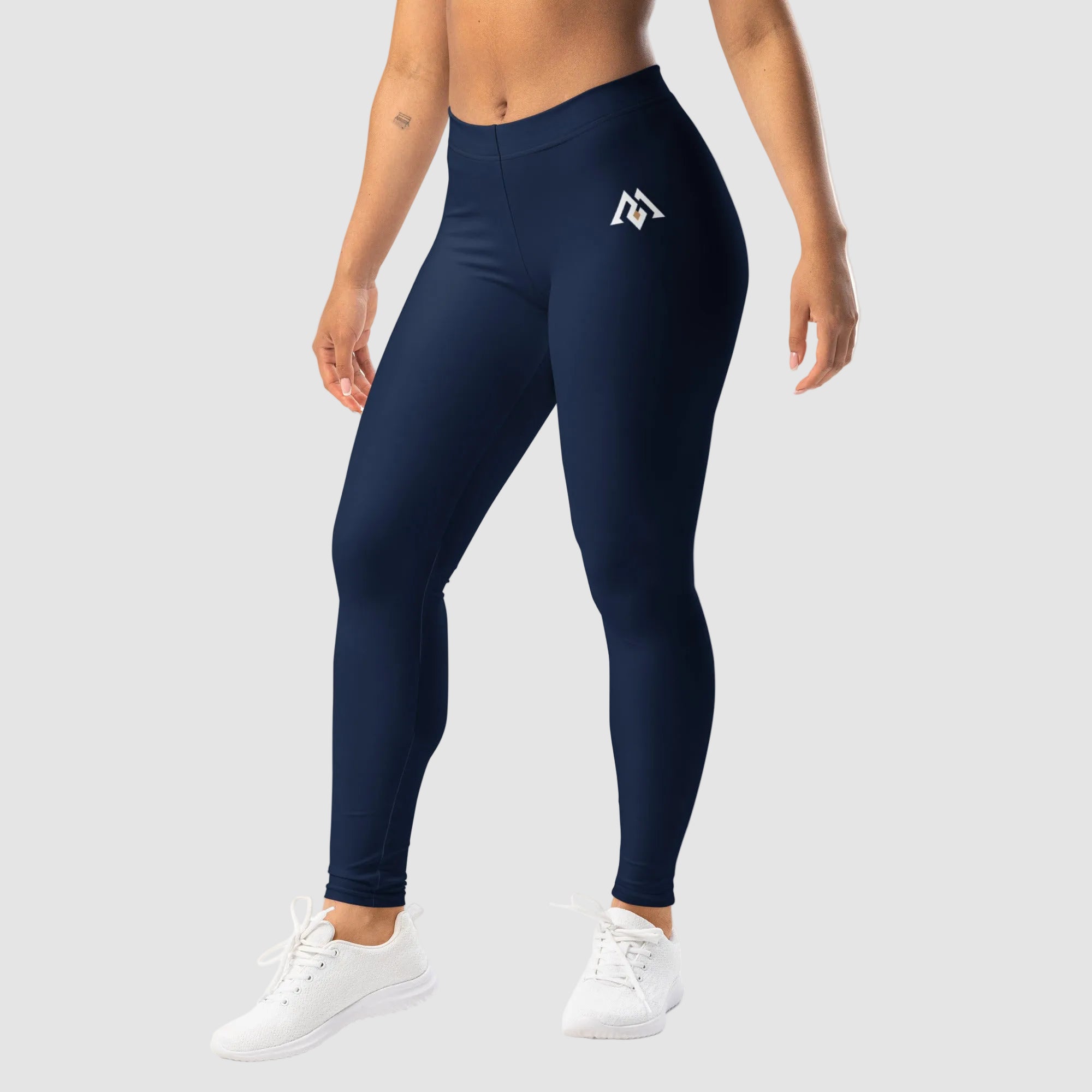 Navy leggings with a logo worn by a person on a white background