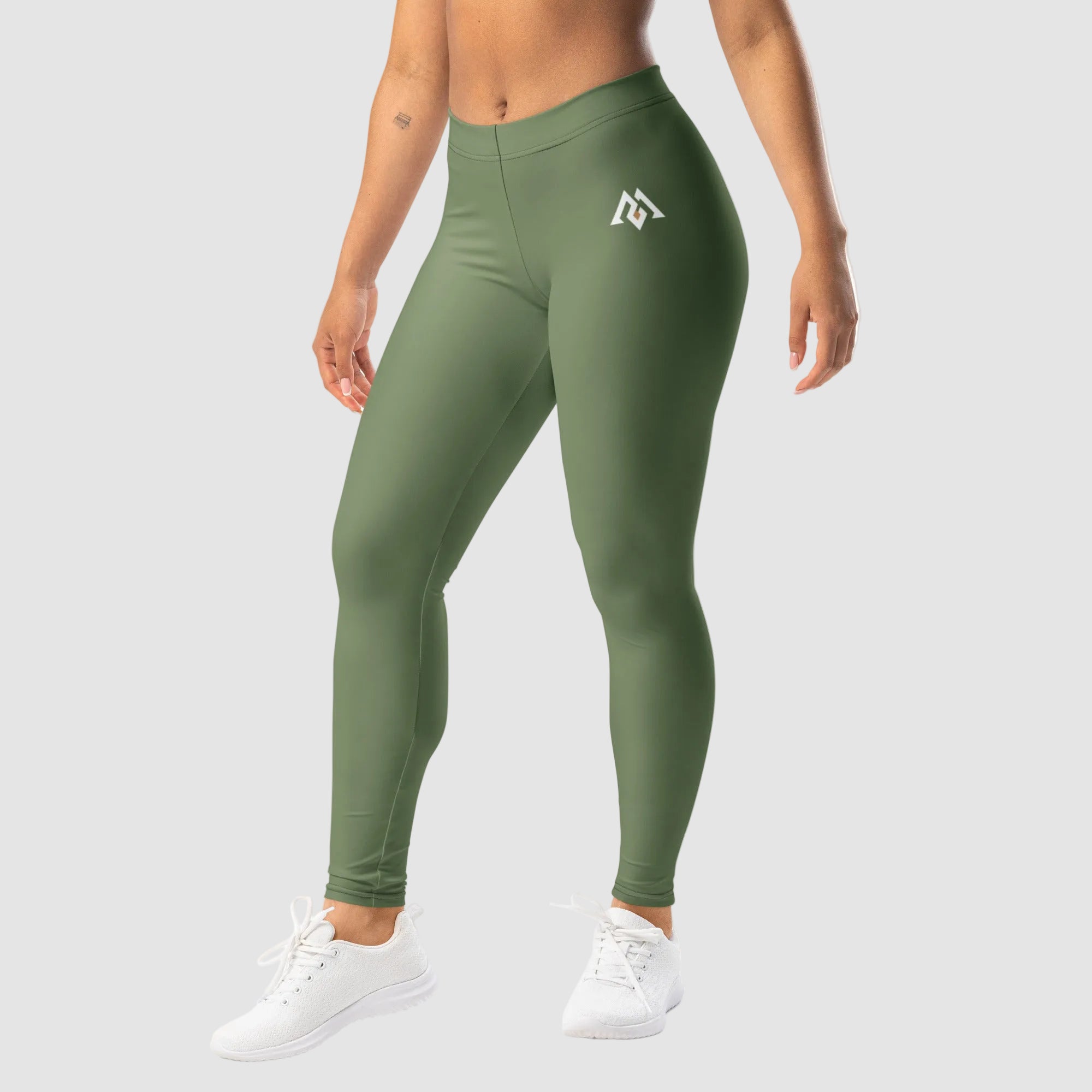 Green leggings with a logo worn by a person on a white background