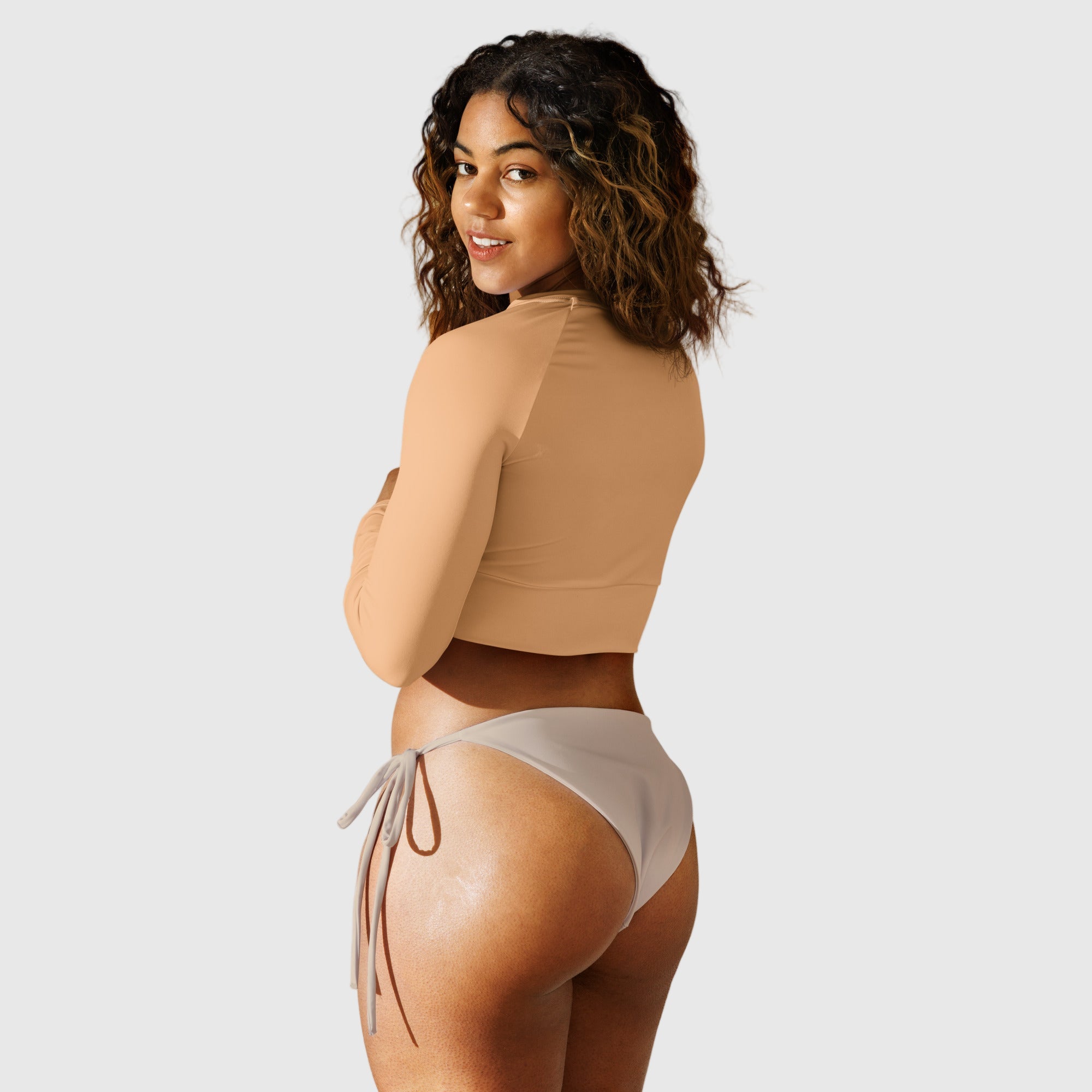 Active Aegis Recycled Long-Sleeve Crop Top in black, made from recycled polyester with sleek, breathable compression fit — ideal for gym, yoga, and sustainable everyday wear.