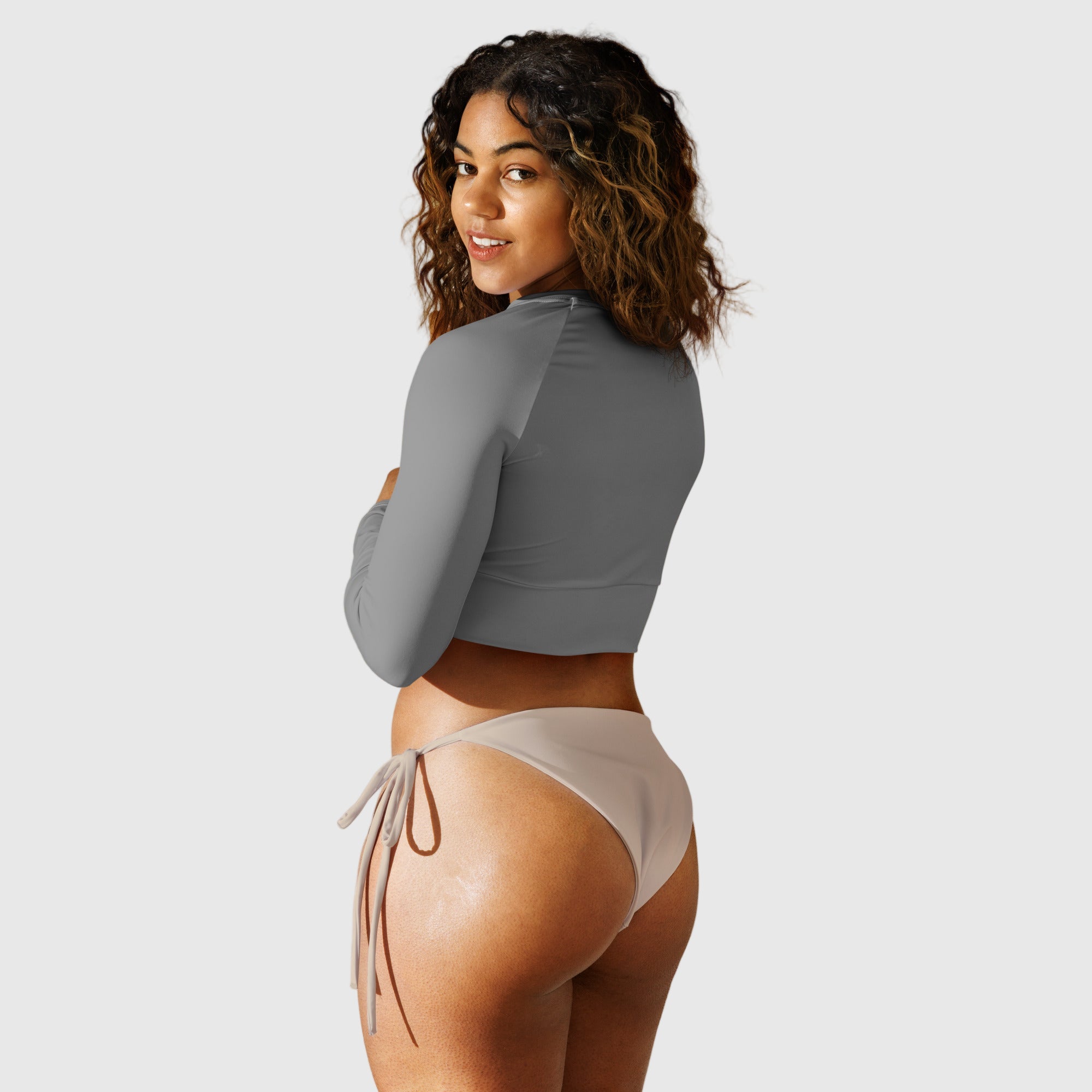 Active Aegis Recycled Long-Sleeve Crop Top in black, made from recycled polyester with sleek, breathable compression fit — ideal for gym, yoga, and sustainable everyday wear.