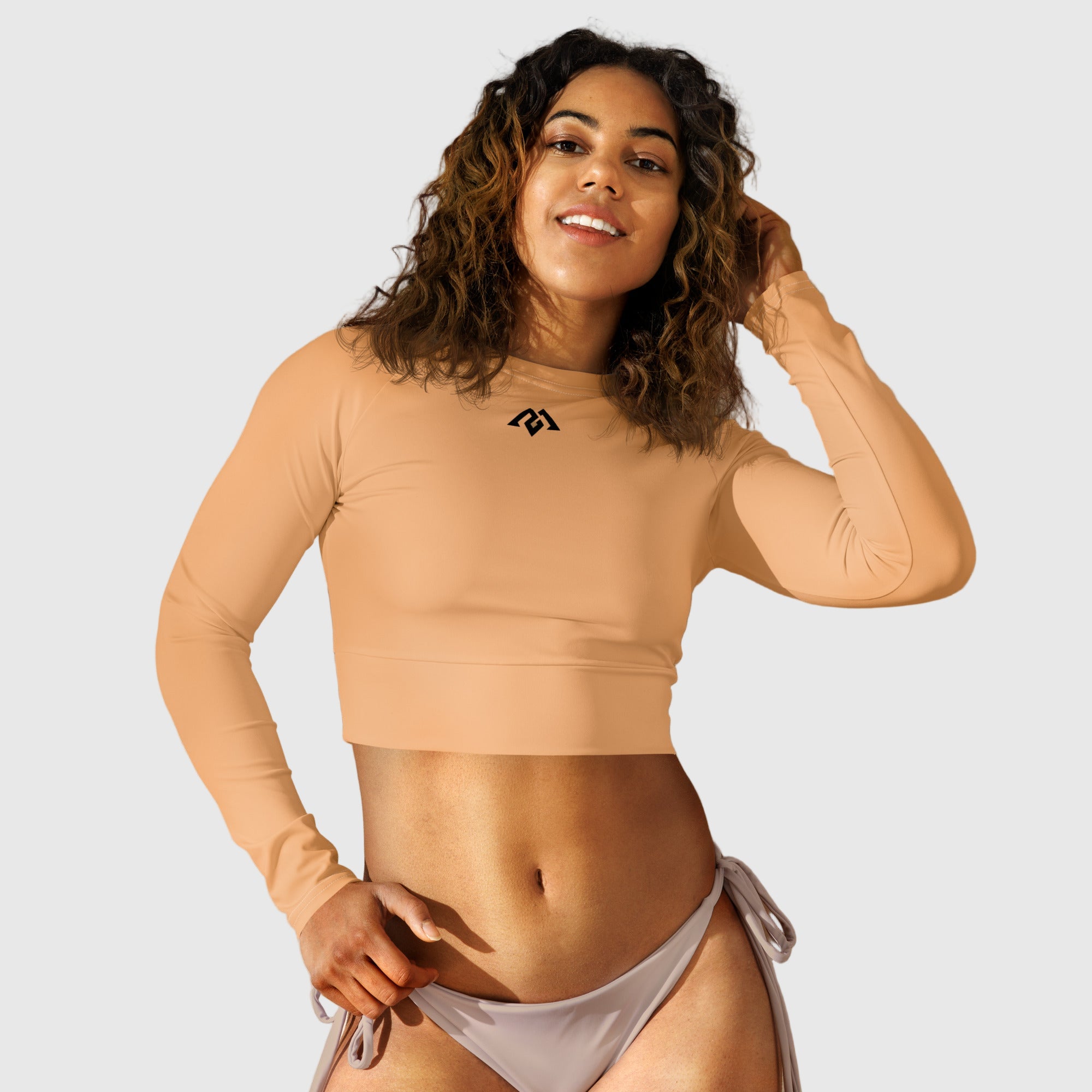 Active Aegis Recycled Long-Sleeve Crop Top in black, made from recycled polyester with sleek, breathable compression fit — ideal for gym, yoga, and sustainable everyday wear.