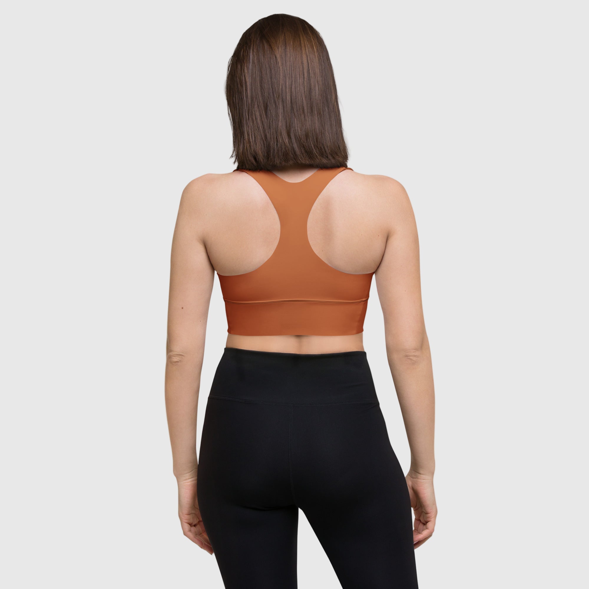 Brown recycled longline sports bra by ActiveAegis – eco-friendly, supportive, and breathable women’s activewear for fitness, yoga, and gym training.