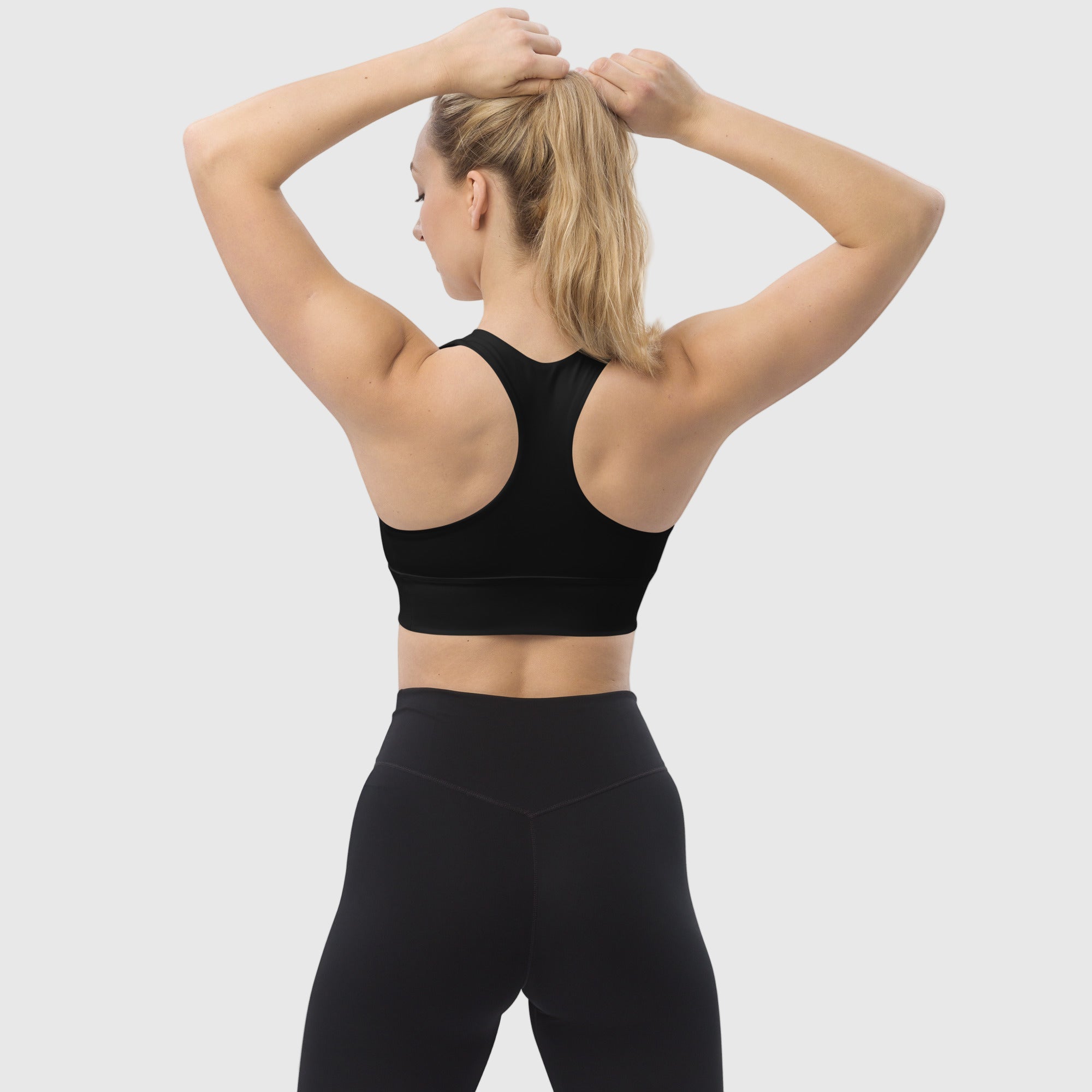 Black recycled longline sports bra by ActiveAegis – eco-friendly, breathable, and supportive activewear for women’s gym, yoga, and fitness sessions.