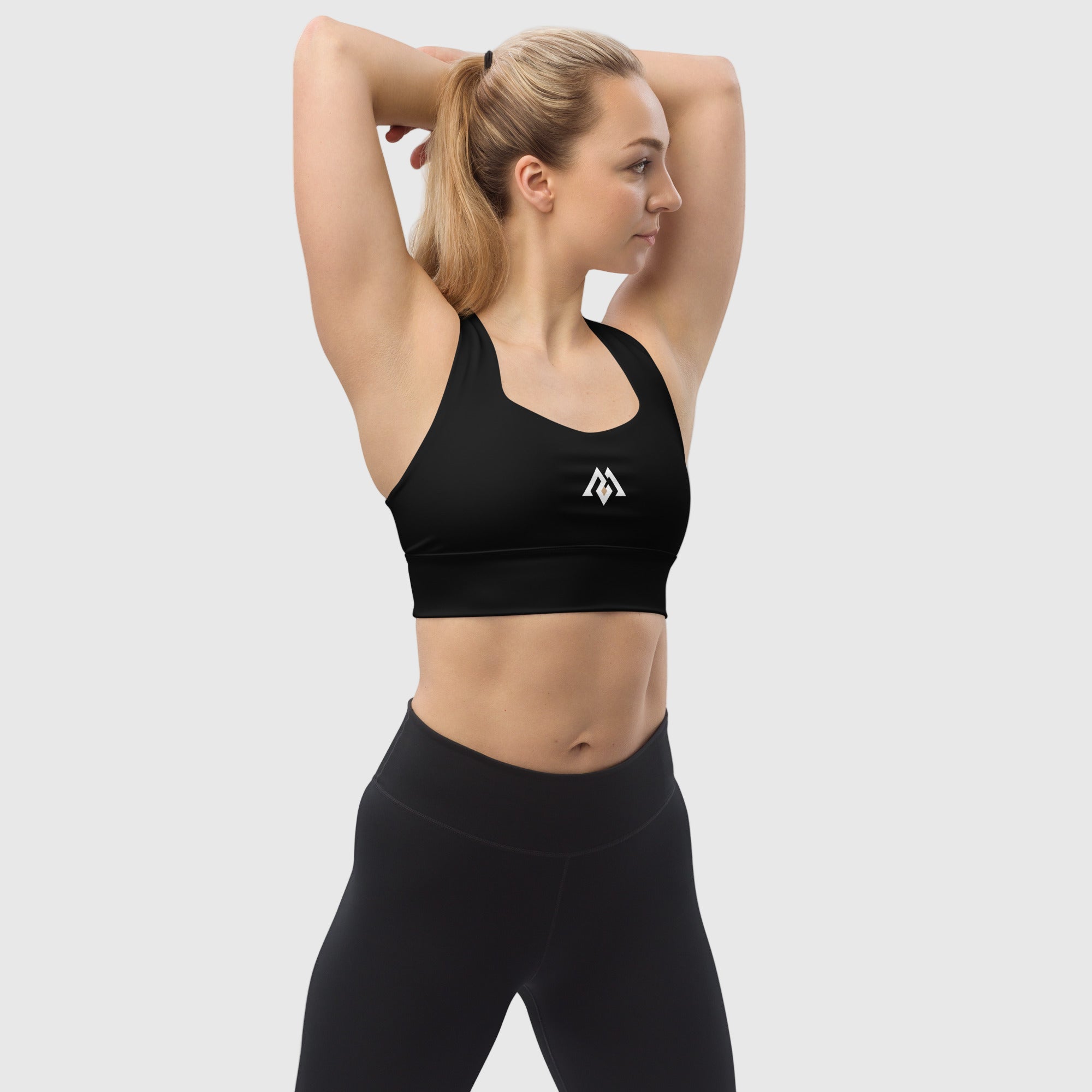 Black recycled longline sports bra by ActiveAegis – eco-friendly, breathable, and supportive activewear for women’s gym, yoga, and fitness sessions.