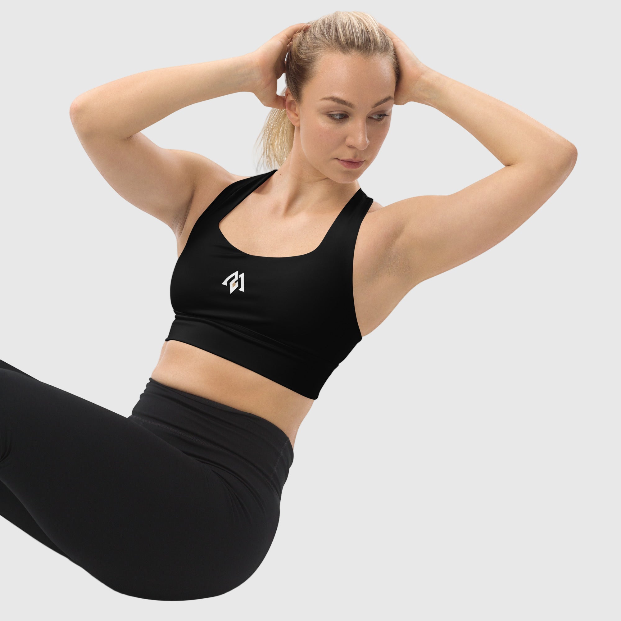 Black recycled longline sports bra by ActiveAegis – eco-friendly, breathable, and supportive activewear for women’s gym, yoga, and fitness sessions.