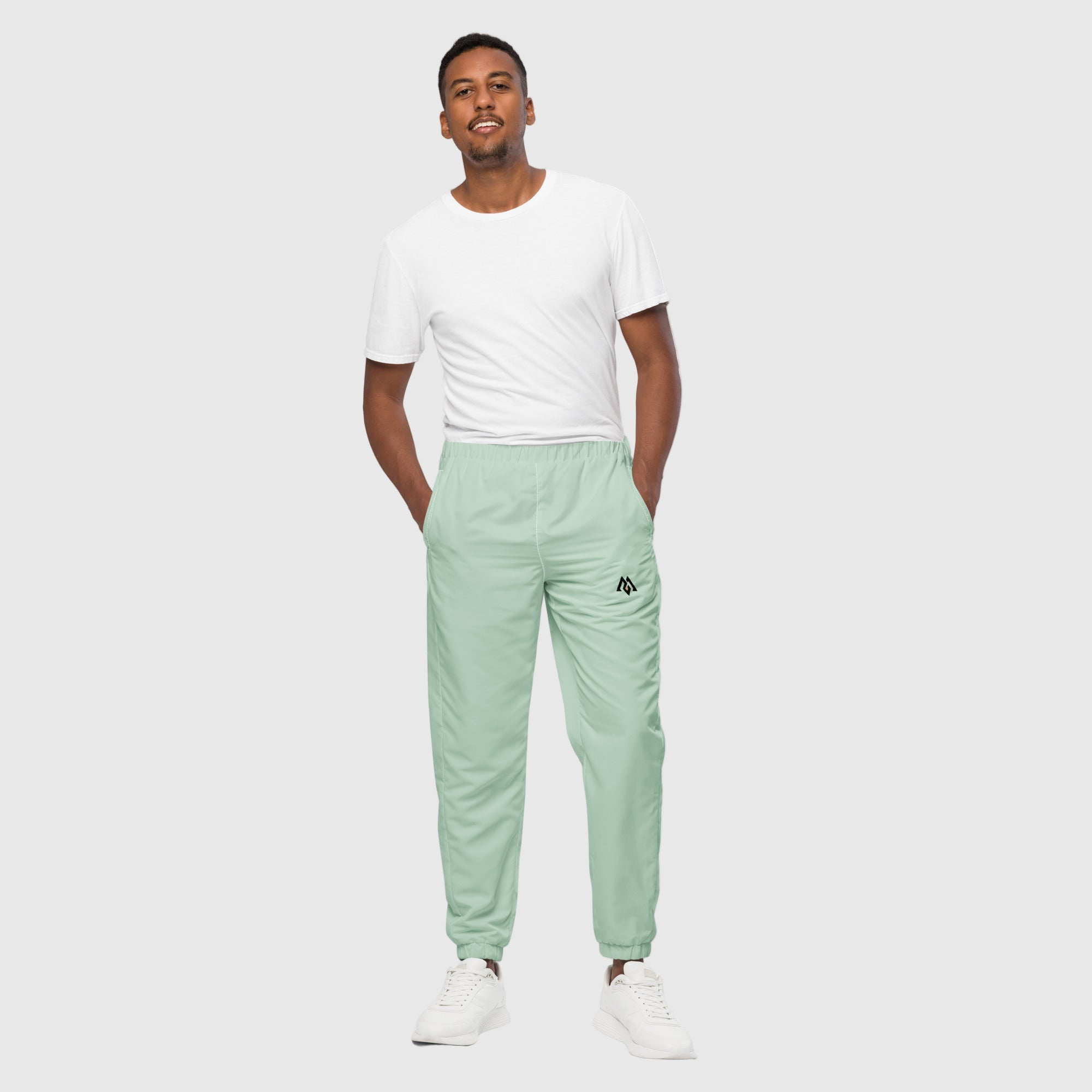 Model wearing ActiveAegis Unisex Track Pants in Edgewater Blue – lightweight, breathable, and stretch-fit eco-friendly performance joggers