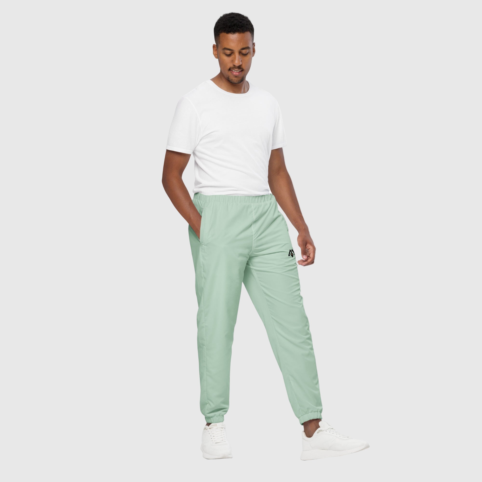 Model wearing ActiveAegis Unisex Track Pants in Edgewater Blue – lightweight, breathable, and stretch-fit eco-friendly performance joggers