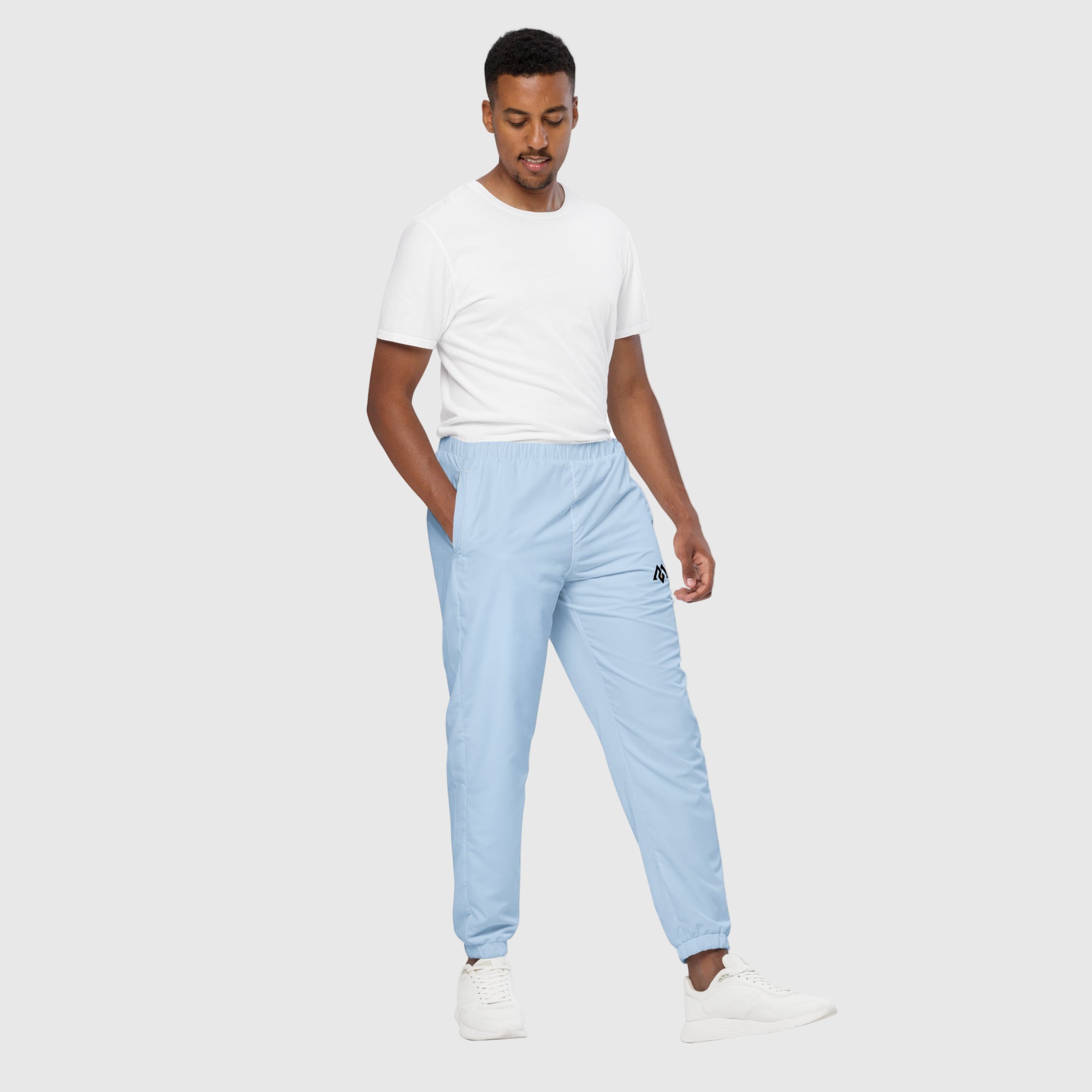 Model wearing ActiveAegis Unisex Track Pants in Pattens Blue – eco-friendly, stretch-fit, and breathable tapered joggers for gym and lifestyle comfort