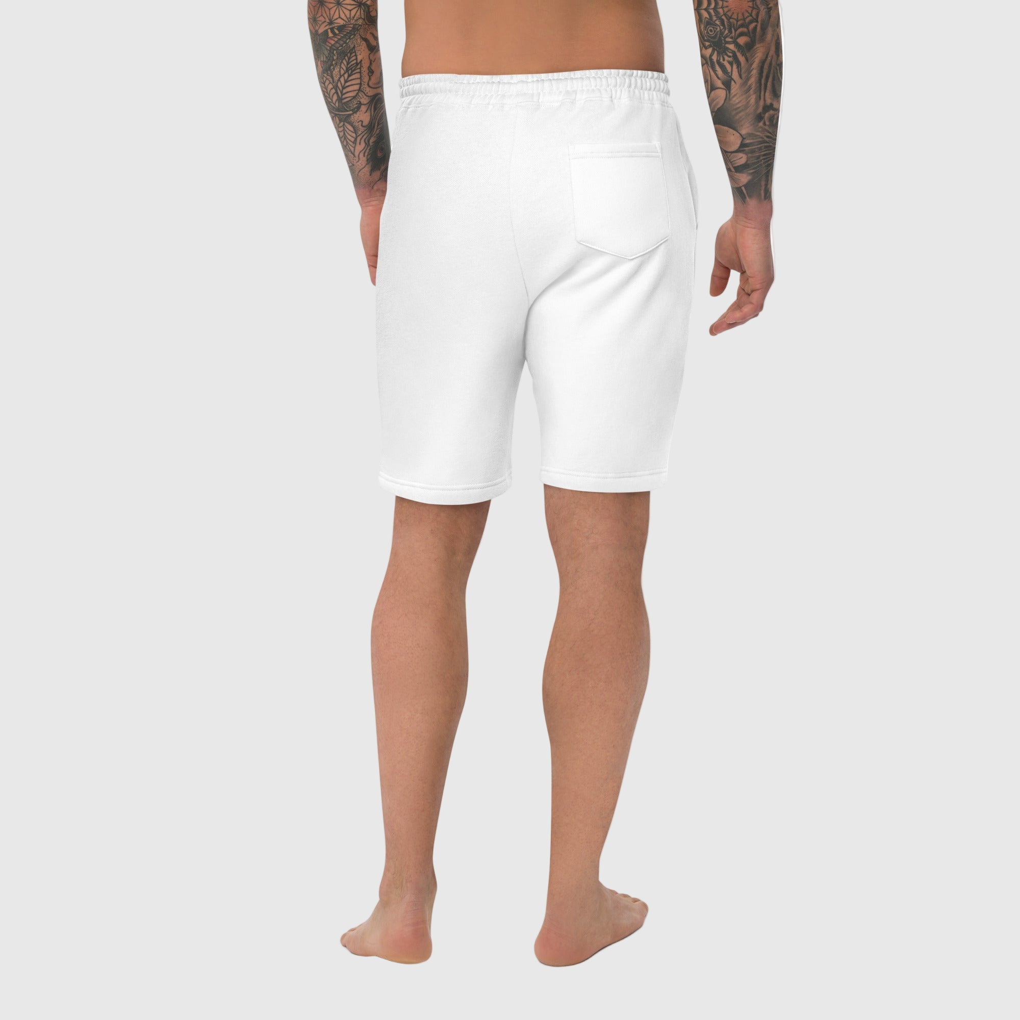 White shorts worn by a person on a white background