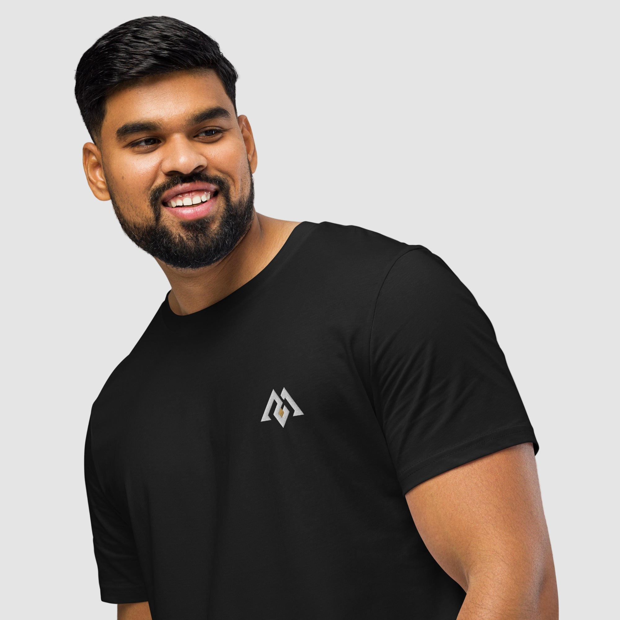 Model wearing ActiveAegis Unisex Organic Mid-Light T-Shirt in black – breathable 100% organic cotton tee designed for sustainable comfort and everyday performance.