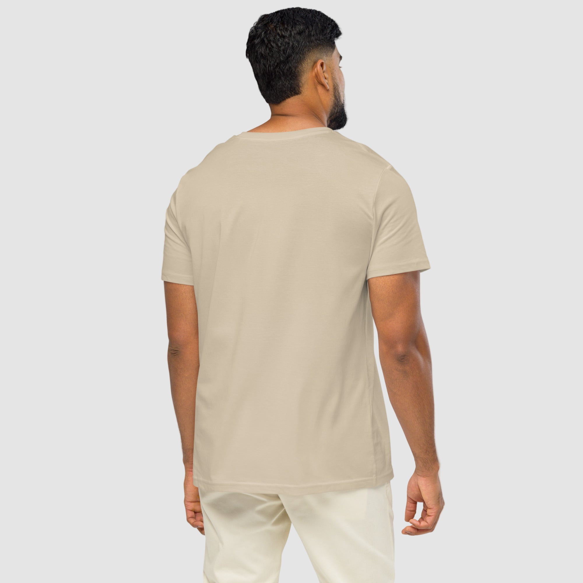 Model wearing ActiveAegis Unisex Organic Mid-Light T-Shirt in Desert Dust – soft 100% organic cotton tee in warm beige tone, sustainably made for active and casual wear