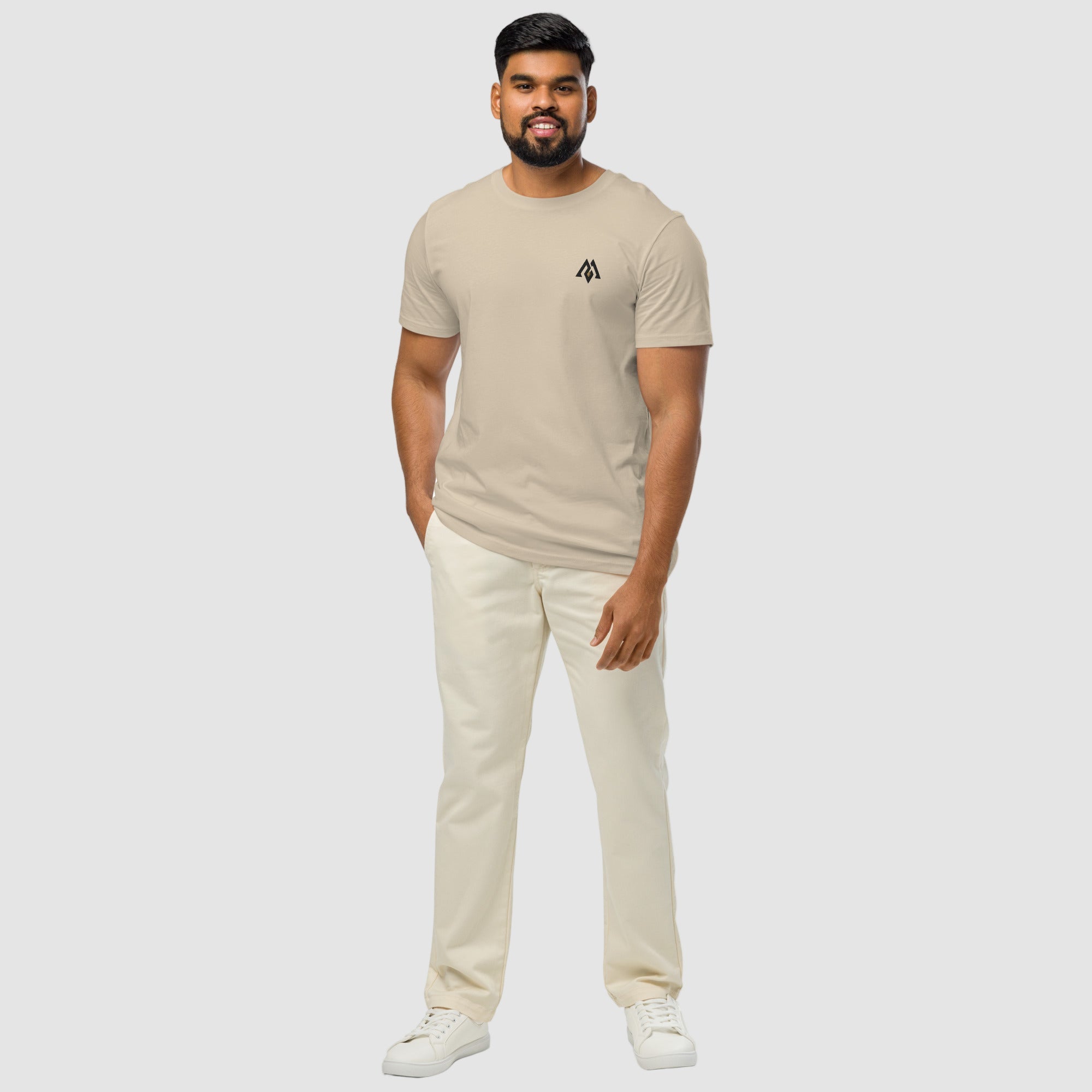 Model wearing ActiveAegis Unisex Organic Mid-Light T-Shirt in Desert Dust – soft 100% organic cotton tee in warm beige tone, sustainably made for active and casual wear