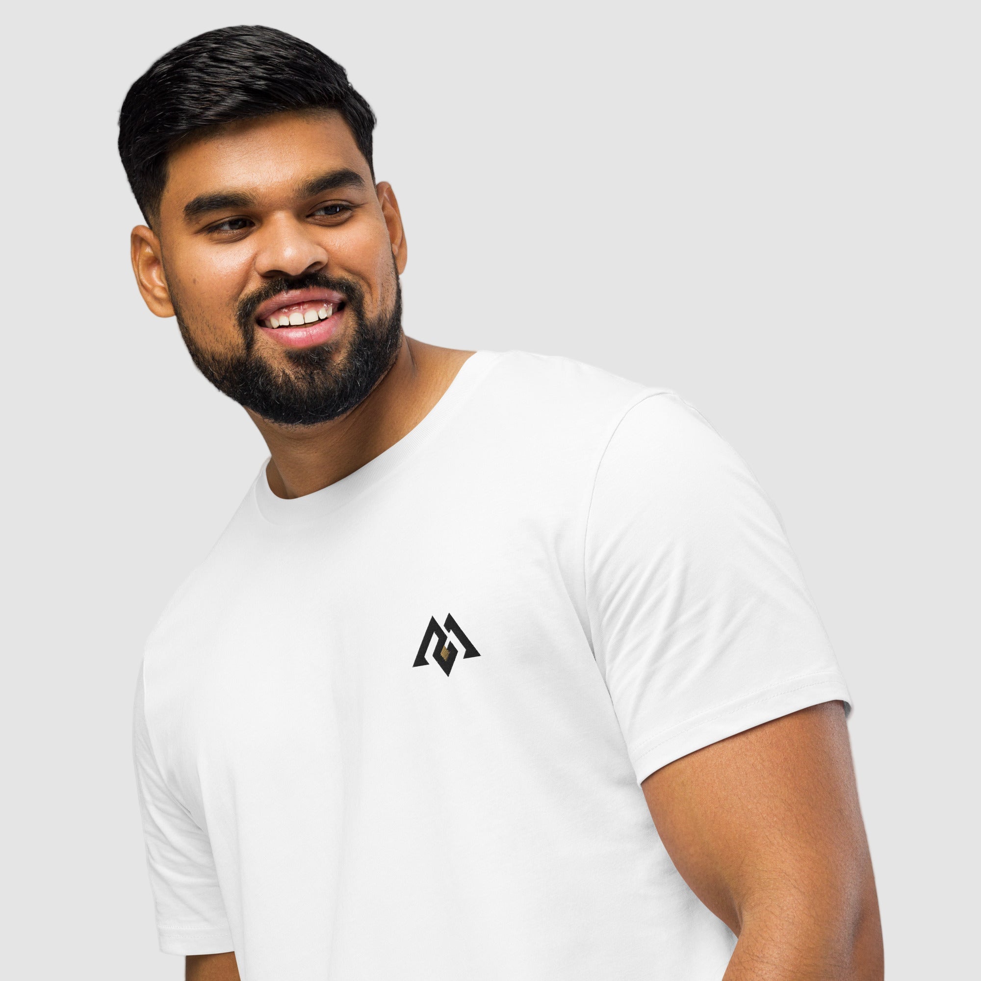 Model wearing ActiveAegis Unisex Organic Mid-Light T-Shirt in white – 100% organic cotton, breathable and sustainably made minimalist activewear.